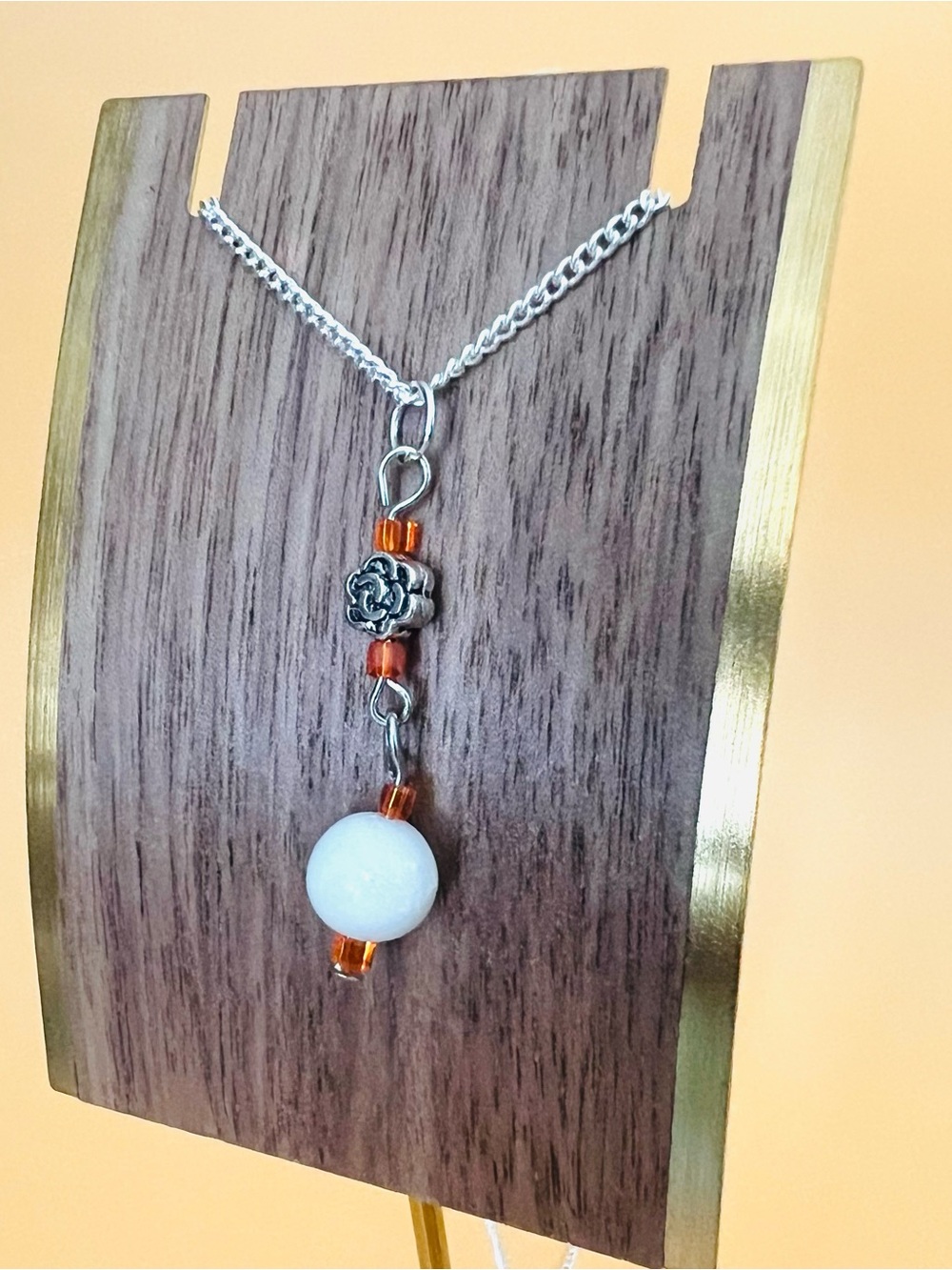 Silver plated Pendant Necklace with White Bead and Orange Accents